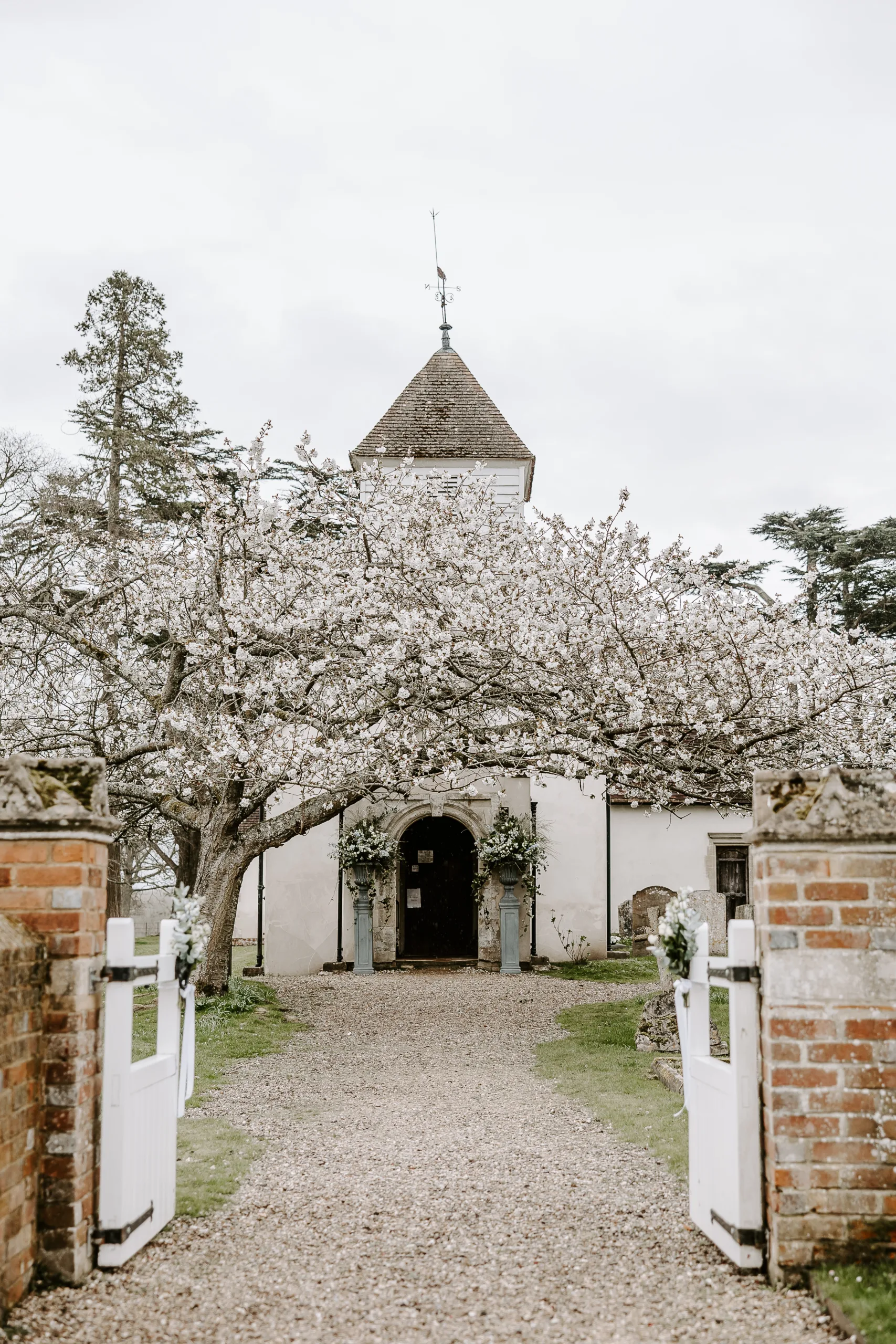 The church with blossom on the trees at Wasing